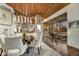 Open dining room area with modern chandelier, hardwood floors, and views of the exterior at 41590 N 108Th St, Scottsdale, AZ 85262
