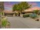 Stunning desert home featuring a large tree, mature landscaping, and a private driveway at 41590 N 108Th St, Scottsdale, AZ 85262