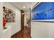 Hallway featuring hardwood floors and contemporary artwork at 41590 N 108Th St, Scottsdale, AZ 85262