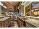 Custom kitchen featuring stone backsplash, stainless steel appliances, and wood ceiling at 41590 N 108Th St, Scottsdale, AZ 85262