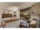 Cozy living room with fireplace and large windows offering scenic views at 41590 N 108Th St, Scottsdale, AZ 85262