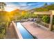 Inviting backyard oasis features a private pool, spa, and scenic mountain views in this luxury desert home at 41590 N 108Th St, Scottsdale, AZ 85262