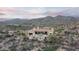 Expansive desert property boasting a large pool, patio, and stunning mountain views at 42155 N 97Th Way, Scottsdale, AZ 85262