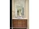 Neutral bathroom features a granite countertop, wooden cabinets, and stylish fixtures at 42155 N 97Th Way, Scottsdale, AZ 85262