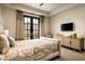 Bright bedroom features neutral tones, access to outdoors, and decorative furniture at 42155 N 97Th Way, Scottsdale, AZ 85262