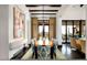 Elegant dining room with stylish chairs, a wooden table, and beautiful views of the outdoor landscape at 42155 N 97Th Way, Scottsdale, AZ 85262