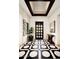 Bright foyer with eye-catching tile flooring, a modern ceiling design, and elegant decor accents at 42155 N 97Th Way, Scottsdale, AZ 85262