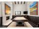 Elegant game room with a billiards table, fireplace, dark wood accents and custom lighting at 42155 N 97Th Way, Scottsdale, AZ 85262