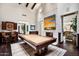 Entertain in style with a billiards table, fireplace, dark wood accents, and custom decor at 42155 N 97Th Way, Scottsdale, AZ 85262