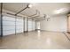 Spacious three-car garage with epoxy flooring, ready for car parking and storage at 42155 N 97Th Way, Scottsdale, AZ 85262