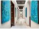 Inviting hallway with high ceilings, modern art, and a view to the dining area at 42155 N 97Th Way, Scottsdale, AZ 85262
