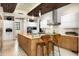 Spacious kitchen with custom cabinets, stainless steel appliances, large island and breakfast bar seating at 42155 N 97Th Way, Scottsdale, AZ 85262