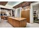 Modern kitchen featuring a large island, custom cabinetry, and an open floor plan into the living area at 42155 N 97Th Way, Scottsdale, AZ 85262