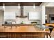Contemporary kitchen boasting stainless steel appliances, custom cabinets, large island and breakfast bar at 42155 N 97Th Way, Scottsdale, AZ 85262