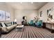 Inviting living room featuring stylish decor, comfortable seating, and bright, natural light at 42155 N 97Th Way, Scottsdale, AZ 85262