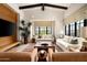 Bright living room featuring comfortable seating, a fireplace, a large window with natural light at 42155 N 97Th Way, Scottsdale, AZ 85262
