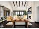 Sophisticated living room with beamed ceilings, a cozy fireplace, and scenic outdoor views at 42155 N 97Th Way, Scottsdale, AZ 85262
