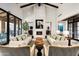 Bright living room with a fireplace, high ceilings, modern furniture, and seamless indoor-outdoor living at 42155 N 97Th Way, Scottsdale, AZ 85262