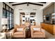 Comfortable living room showcases neutral tones, an open floor plan, with a kitchen and dining area view at 42155 N 97Th Way, Scottsdale, AZ 85262