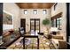 Sophisticated office space with custom built-ins, a large window, and designer furnishings at 42155 N 97Th Way, Scottsdale, AZ 85262