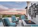 Beautiful outdoor living space with comfortable seating, a fire pit, and picturesque mountain views at 42155 N 97Th Way, Scottsdale, AZ 85262