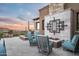 Elegant outdoor patio with a fire pit, comfortable seating, and stunning desert views at 42155 N 97Th Way, Scottsdale, AZ 85262