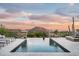 Inviting infinity pool and spa offer stunning mountain views at sunset, perfect for relaxing or entertaining at 42155 N 97Th Way, Scottsdale, AZ 85262