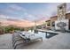 Luxury outdoor pool featuring lounge chairs, a built-in grill, beautiful landscaping, and panoramic mountain views at 42155 N 97Th Way, Scottsdale, AZ 85262