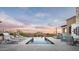 Luxury outdoor pool area featuring a built-in grill, lounge chairs, infinity pool, and scenic views at 42155 N 97Th Way, Scottsdale, AZ 85262