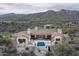 Aerial view featuring a backyard with a pool, patio, and mountain views at 42155 N 97Th Way, Scottsdale, AZ 85262