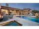 Beautiful swimming pool and spa area with outdoor seating and grill at 42155 N 97Th Way, Scottsdale, AZ 85262