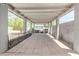 Covered backyard patio features concrete pavers, barbecue, and seating at 4303 N 18Th St, Phoenix, AZ 85016