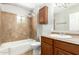 Bathroom with tiled shower, vanity with a sink, and a mirror at 4303 N 18Th St, Phoenix, AZ 85016