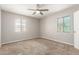 Bright bedroom features neutral walls, carpeted floors, and two windows at 4303 N 18Th St, Phoenix, AZ 85016