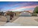 Charming single-story home with a well-maintained lawn and a spacious driveway at 5225 E Hearn Rd, Scottsdale, AZ 85254