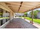 Covered back patio featuring red brick pavers and views of the backyard at 5319 E Gelding Dr, Scottsdale, AZ 85254