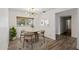 Charming dining room featuring stylish light fixture, round table, and natural light at 5319 E Gelding Dr, Scottsdale, AZ 85254