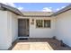 Welcoming front entrance featuring a stylish door, decorative tiles, and a charming brick walkway at 5319 E Gelding Dr, Scottsdale, AZ 85254
