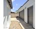 Modern gray garage with adjacent pedestrian door offering convenient access to the property at 5319 E Gelding Dr, Scottsdale, AZ 85254