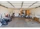 Large garage with overhead door, storage cabinets, and potential for customization to suit various needs at 5319 E Gelding Dr, Scottsdale, AZ 85254