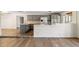 Bright and modern kitchen featuring gray cabinets and white countertops with stainless steel appliances at 5319 E Gelding Dr, Scottsdale, AZ 85254