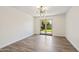 Minimalist living room space with new floors and sliding doors to backyard patio at 5319 E Gelding Dr, Scottsdale, AZ 85254