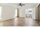 Spacious main bedroom featuring wood-look floors, lots of light, and access to en-suite bathroom at 5319 E Gelding Dr, Scottsdale, AZ 85254