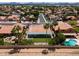 An aerial view shows the lush landscaping and beautiful pool in a well-kept neighborhood at 5402 E Michelle Dr, Scottsdale, AZ 85254