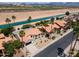 An aerial view showcases the home's location in a neighborhood near a picturesque canal at 5402 E Michelle Dr, Scottsdale, AZ 85254