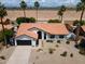 Aerial view of a desert home featuring a terracotta tile roof and well-maintained landscaping at 5402 E Michelle Dr, Scottsdale, AZ 85254