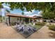 Inviting backyard with a fire pit and patio seating, perfect for outdoor entertaining at 5402 E Michelle Dr, Scottsdale, AZ 85254