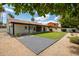 A well-maintained lawn with a brick patio offers a serene outdoor living space at 5402 E Michelle Dr, Scottsdale, AZ 85254