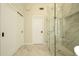 Bathroom with tiled shower, glass door, and dual shower heads, plus closet with sliding doors at 5402 E Michelle Dr, Scottsdale, AZ 85254