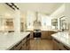 Modern kitchen with stainless steel appliances, light countertops, and stylish cabinetry at 5402 E Michelle Dr, Scottsdale, AZ 85254